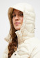 preview Women´s jacket Peak Performance Helium Hybrid Down Hood Jkt W Sand Fog N36